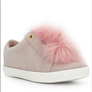 A stylish light pink sneaker.